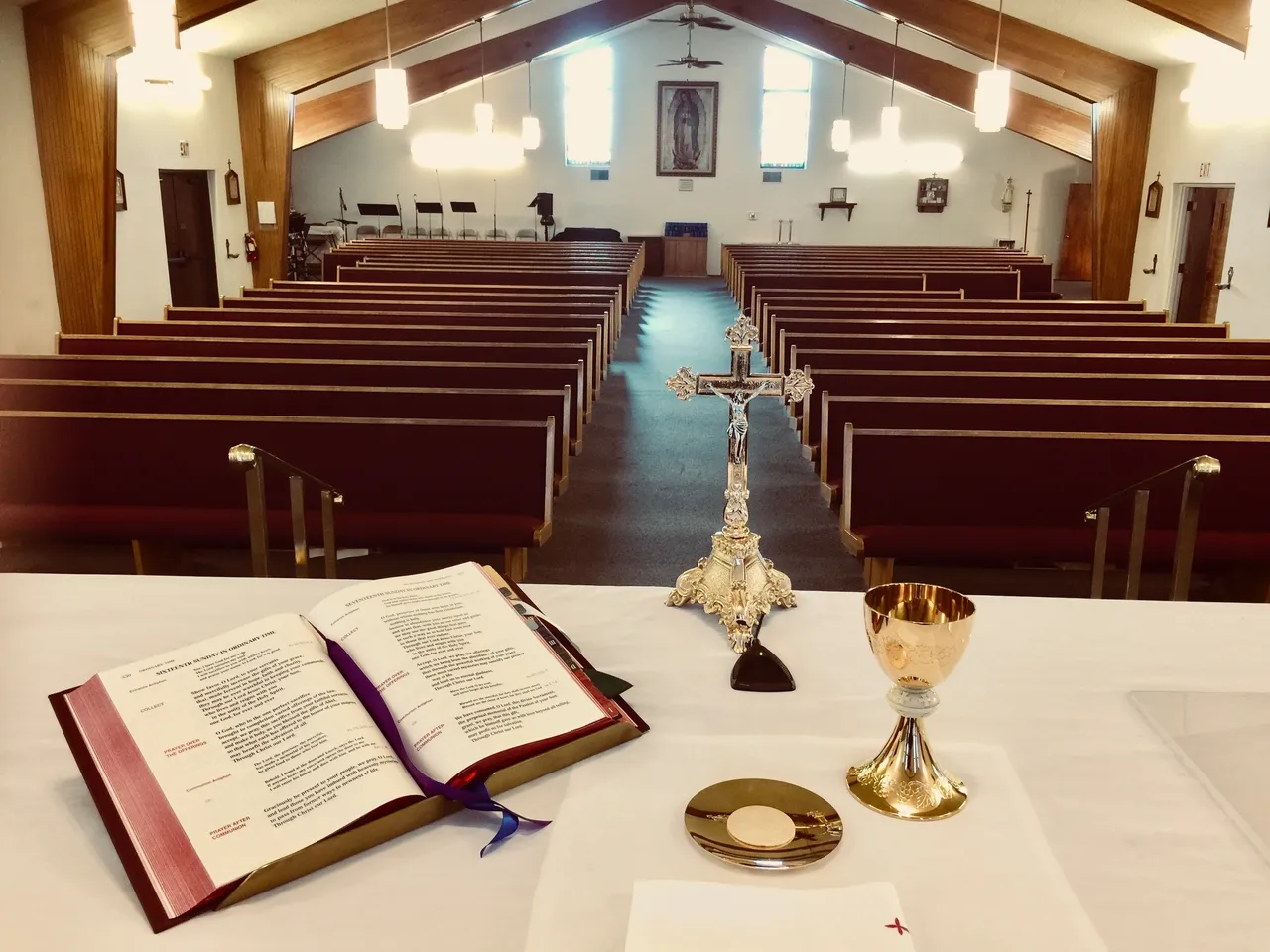 A church with pews and a table in front of it