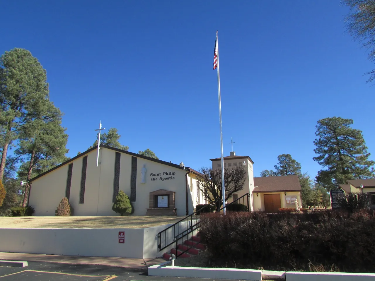 A church with a flag flying on top of it.