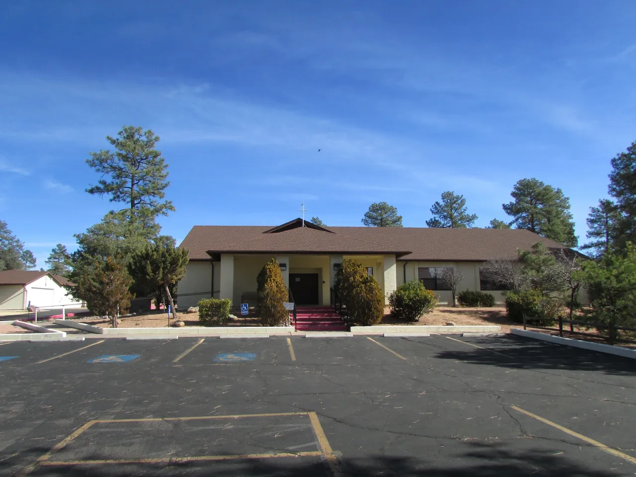 A large building with trees in the background