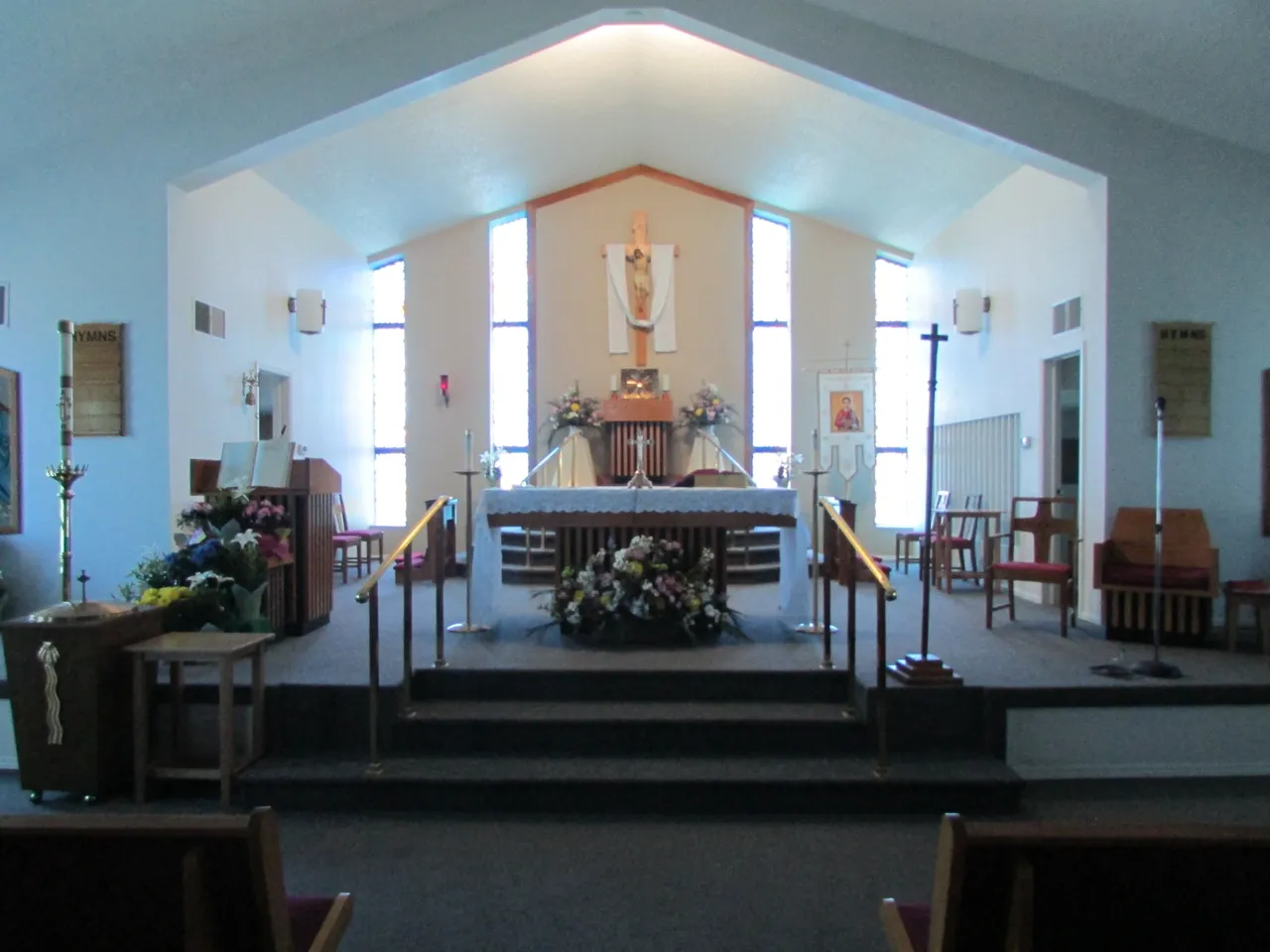 A church with a large altar and pews.